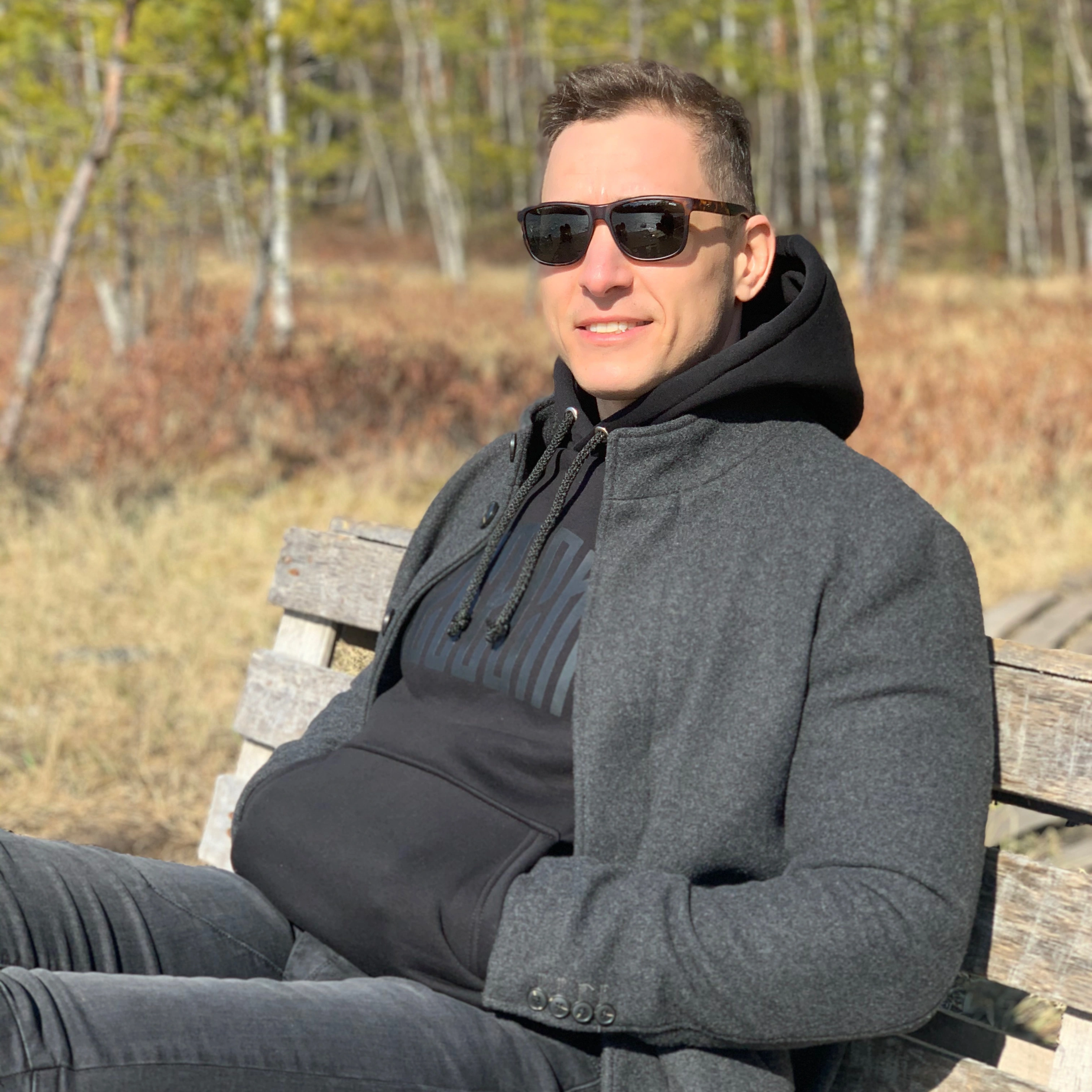 male client sitting on bench testimonial Super Hero Build general contractor Los Angeles